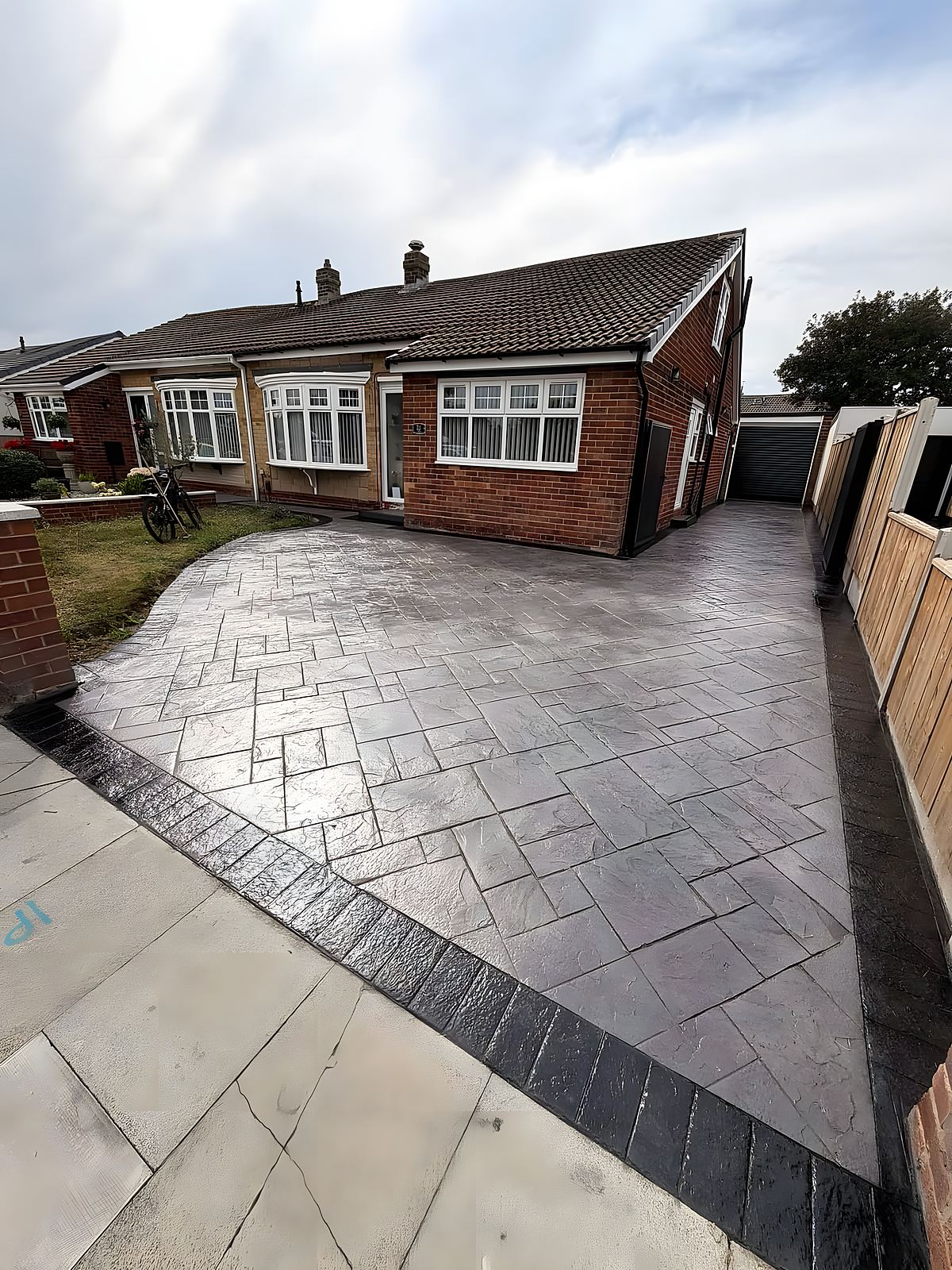 A freshly laid pattern-imprinted concrete driveway by Paver Nottingham