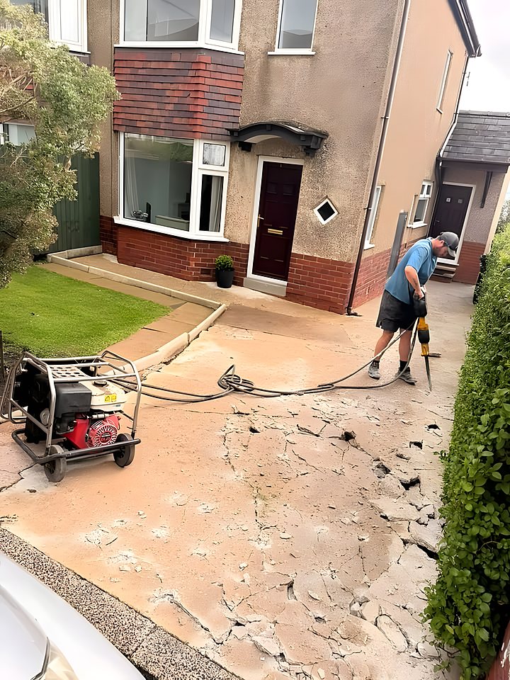 Breaking out an old concrete driveway to prepare a fresh sub-base